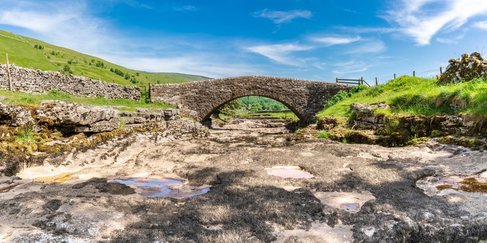 Stone bridge over dry riverbed