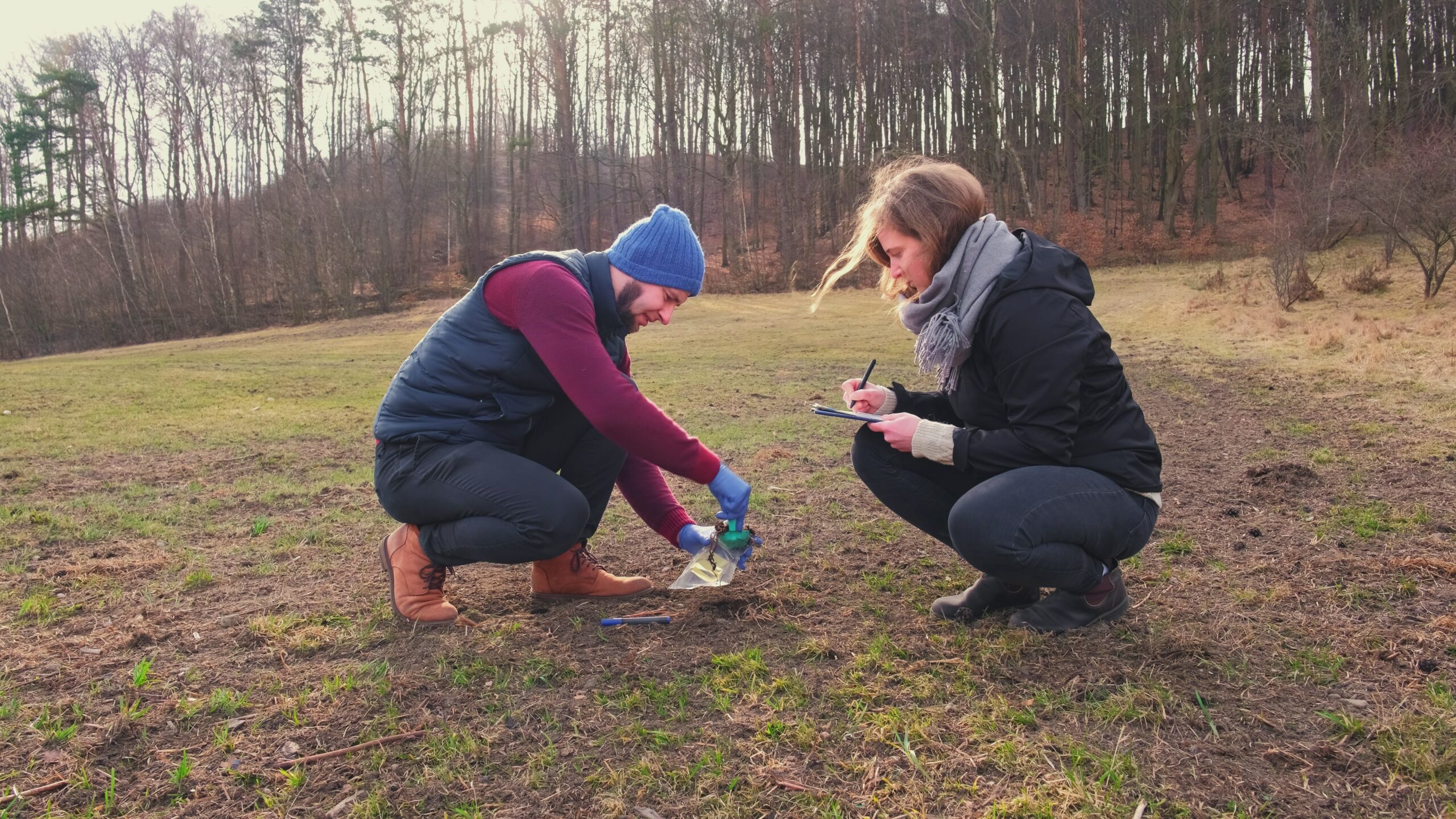 Scientists collecting soil samples out in the field